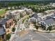 A vibrant mixed-use community featuring retail and residential buildings nestled among lush trees and well-maintained streets at 1206 Red Fox Cir, Woodstock, GA 30188