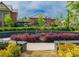 Beautiful community artwork featuring a bicycle statue surrounded by colorful plants and manicured landscaping at 1206 Red Fox Cir, Woodstock, GA 30188