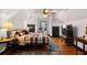 Spacious bedroom with hardwood floors and an adjacent workspace at 1206 Red Fox Cir, Woodstock, GA 30188