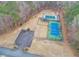 Aerial view showcasing the community pool, tennis court, playground, and a parking lot at 1206 Red Fox Cir, Woodstock, GA 30188