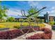 Community with bike sculpture in park setting, featuring manicured lawns and flowering beds under a clear blue sky at 1206 Red Fox Cir, Woodstock, GA 30188