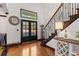 Inviting foyer featuring a staircase, contemporary floors, and natural light at 1206 Red Fox Cir, Woodstock, GA 30188