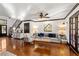 Cozy living room with neutral tones, a decorative fireplace, and hardwood floors at 1206 Red Fox Cir, Woodstock, GA 30188