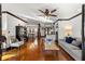 Open concept living space with comfortable seating, hardwood floors, and ample natural light at 1206 Red Fox Cir, Woodstock, GA 30188
