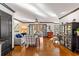 Spacious living room with ample seating, abundant lighting, and hardwood floors at 1206 Red Fox Cir, Woodstock, GA 30188