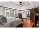 Tranquil main bedroom boasts hardwood floors, lots of windows, and ensuite bathroom access at 1206 Red Fox Cir, Woodstock, GA 30188