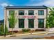 Exterior of a restaurant with brick facade, black-framed windows and manicured landscaping, creating a welcoming ambiance at 1206 Red Fox Cir, Woodstock, GA 30188