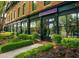 Exterior of a retail store with a large display windows and lush landscaping, creating a charming commercial setting at 1206 Red Fox Cir, Woodstock, GA 30188