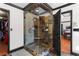 Luxurious walk-in shower featuring slate tile surround and a glass enclosure at 1206 Red Fox Cir, Woodstock, GA 30188