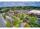 An aerial view of a commercial area with multiple buildings, green spaces, and a parking lot at 213 The South Chace Ne, Sandy Springs, GA 30328