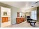 A bright bedroom with comfortable seating, natural light, carpet, and warm decor, leading to a bathroom at 213 The South Chace Ne, Sandy Springs, GA 30328