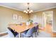 Inviting dining room featuring hardwood floors, a modern chandelier, and elegant decor for sophisticated gatherings at 213 The South Chace Ne, Sandy Springs, GA 30328