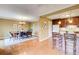 Open-concept dining room with hardwood floors, stylish chandelier, and seamless access to a modern kitchen at 213 The South Chace Ne, Sandy Springs, GA 30328