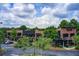 Exterior shot of a two-story brick building with multiple businesses and a parking lot at 213 The South Chace Ne, Sandy Springs, GA 30328