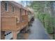 Back exterior view of townhomes showing wooden decks and garage entries at 213 The South Chace Ne, Sandy Springs, GA 30328
