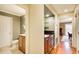 Hallway includes dark wood cabinets, granite countertop, a sink, and a half-bath off to the left side at 213 The South Chace Ne, Sandy Springs, GA 30328