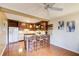 Well-appointed kitchen features bar seating, granite countertops and stainless appliances at 213 The South Chace Ne, Sandy Springs, GA 30328
