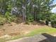 Secluded backyard with mature trees and landscaping, offering privacy and a natural setting at 3070 Ridge Oak Dr, Suwanee, GA 30024