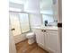 Bathroom featuring shower-tub combination, vanity with sink and wood-look floor at 3070 Ridge Oak Dr, Suwanee, GA 30024