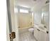 Bathroom featuring a tub/shower combo, toilet, vanity, and white tile floors at 3070 Ridge Oak Dr, Suwanee, GA 30024