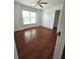 Well-lit bedroom with hardwood floors and a walk-in closet at 3070 Ridge Oak Dr, Suwanee, GA 30024