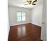Bedroom featuring hardwood floors, natural light, and a ceiling fan at 3070 Ridge Oak Dr, Suwanee, GA 30024