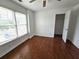 Bedroom with hardwood floors, natural light, and a ceiling fan at 3070 Ridge Oak Dr, Suwanee, GA 30024