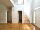 Welcoming foyer with hardwood floors, staircase, and multiple doorways at 3070 Ridge Oak Dr, Suwanee, GA 30024