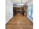 Well-equipped kitchen with stainless steel appliances, wooden cabinetry, and hardwood flooring at 3070 Ridge Oak Dr, Suwanee, GA 30024