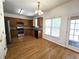 Charming eat-in kitchen featuring wooden cabinets, tile backsplash, and a view to the backyard at 3070 Ridge Oak Dr, Suwanee, GA 30024