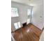 Bright, spacious living room featuring high ceilings, many windows, hardwood floors, and a cozy fireplace at 3070 Ridge Oak Dr, Suwanee, GA 30024