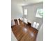 Spacious living room featuring a fireplace, hardwood floors, lots of natural light, and a ceiling fan at 3070 Ridge Oak Dr, Suwanee, GA 30024