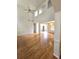 Open-concept living area featuring hardwood floors, high ceilings, and stylish architectural details at 3070 Ridge Oak Dr, Suwanee, GA 30024