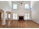Bright living room with high ceilings, hardwood floors, and fireplace at 3070 Ridge Oak Dr, Suwanee, GA 30024
