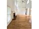 Bright living room showcasing hardwood floors, a fireplace, large windows, and plenty of natural light at 3070 Ridge Oak Dr, Suwanee, GA 30024