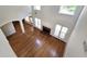 Open living room with hardwood floors, fireplace, and multiple windows at 3070 Ridge Oak Dr, Suwanee, GA 30024