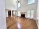Spacious living room with hardwood floors, fireplace, and an open layout at 3070 Ridge Oak Dr, Suwanee, GA 30024