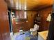 Cozy bathroom featuring a tiled shower, wood paneling and traditional fixtures at 3291 Peachtree St, Lithia Springs, GA 30122