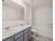 Bathroom featuring double vanity, tub, shower, and modern finishes at 169 Aster Avenue, Locust Grove, GA 30248