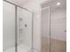 Shower with a glass door and view of the walk-in closet at 169 Aster Avenue, Locust Grove, GA 30248