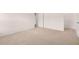 Neutral carpeted bedroom featuring white walls and doors, offering a simple yet elegant look at 169 Aster Avenue, Locust Grove, GA 30248