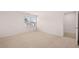 Bright bedroom with a large window, neutral carpet, and fresh white walls at 169 Aster Avenue, Locust Grove, GA 30248