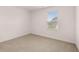 Bedroom with neutral carpet and a window offering natural light at 169 Aster Avenue, Locust Grove, GA 30248