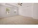 A large bedroom with two windows and a ceiling fan at 169 Aster Avenue, Locust Grove, GA 30248