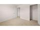 Neutral bedroom with closet and doorway, showcasing an open layout at 169 Aster Avenue, Locust Grove, GA 30248