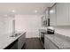 Well-lit kitchen showcasing granite countertops and stainless steel appliances at 169 Aster Avenue, Locust Grove, GA 30248