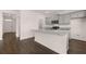 Modern kitchen island featuring a granite countertop and stainless steel faucet at 169 Aster Avenue, Locust Grove, GA 30248