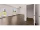 Bright living room with hardwood floors and an adjacent walk-in closet at 169 Aster Avenue, Locust Grove, GA 30248