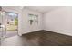 Inviting space with hardwood flooring, a bright window, and a welcoming view through the open front door at 169 Aster Avenue, Locust Grove, GA 30248