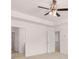 Spacious main bedroom with a ceiling fan and tray ceiling at 169 Aster Avenue, Locust Grove, GA 30248